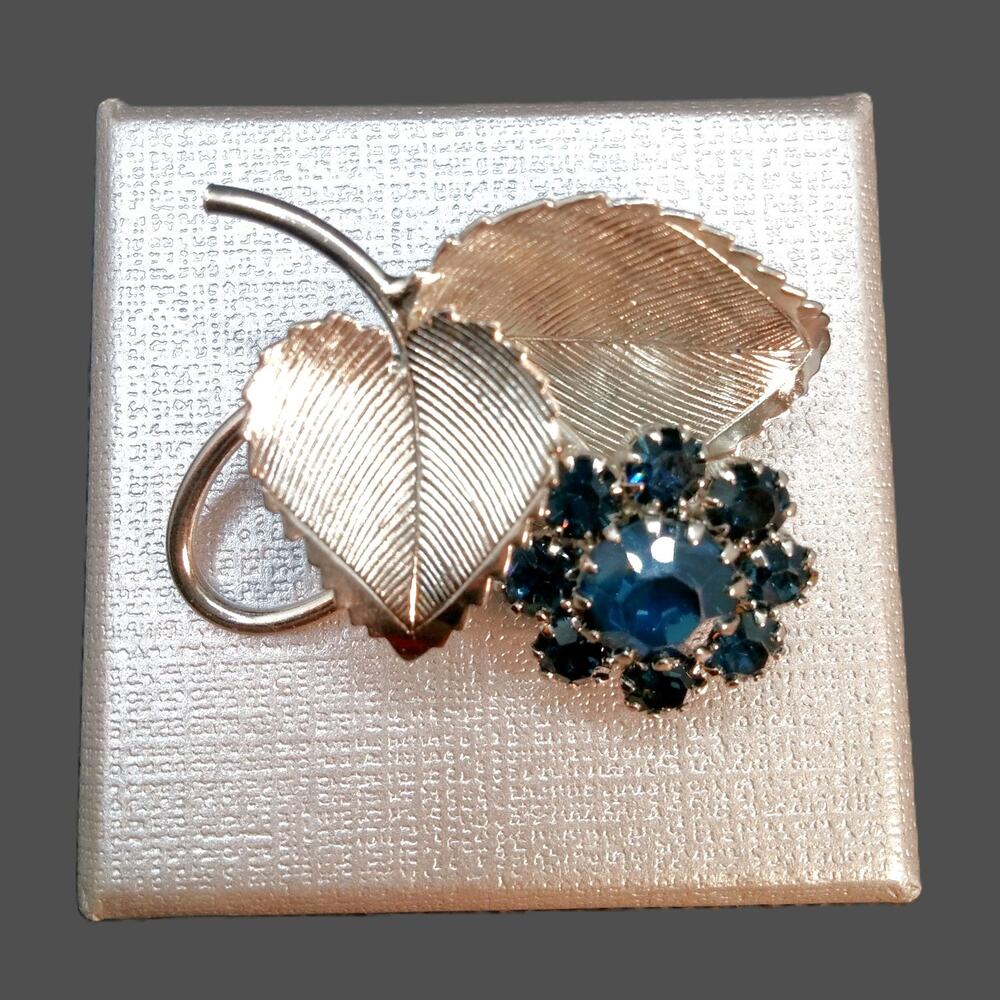 Vintage Silver Tone Flower Brooch Blue Rhinestones Prong Setting Textured Leaves